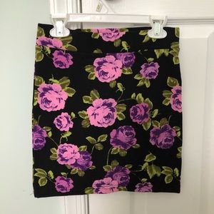 Black skirt with flower pattern.